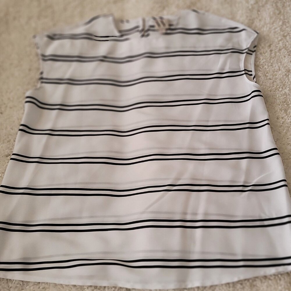 Black and white sleeveless shell size small.